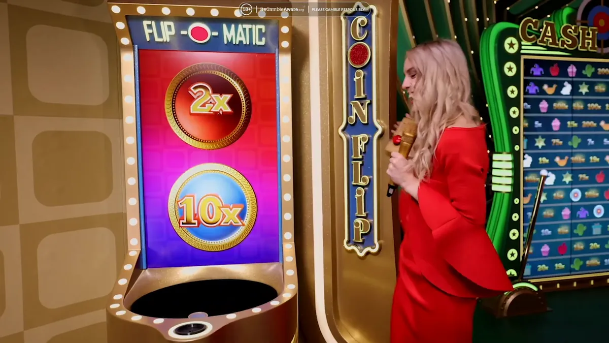 La macchina del Coin Flip con i moltiplicatori 2x e 10x e la conduttrice
